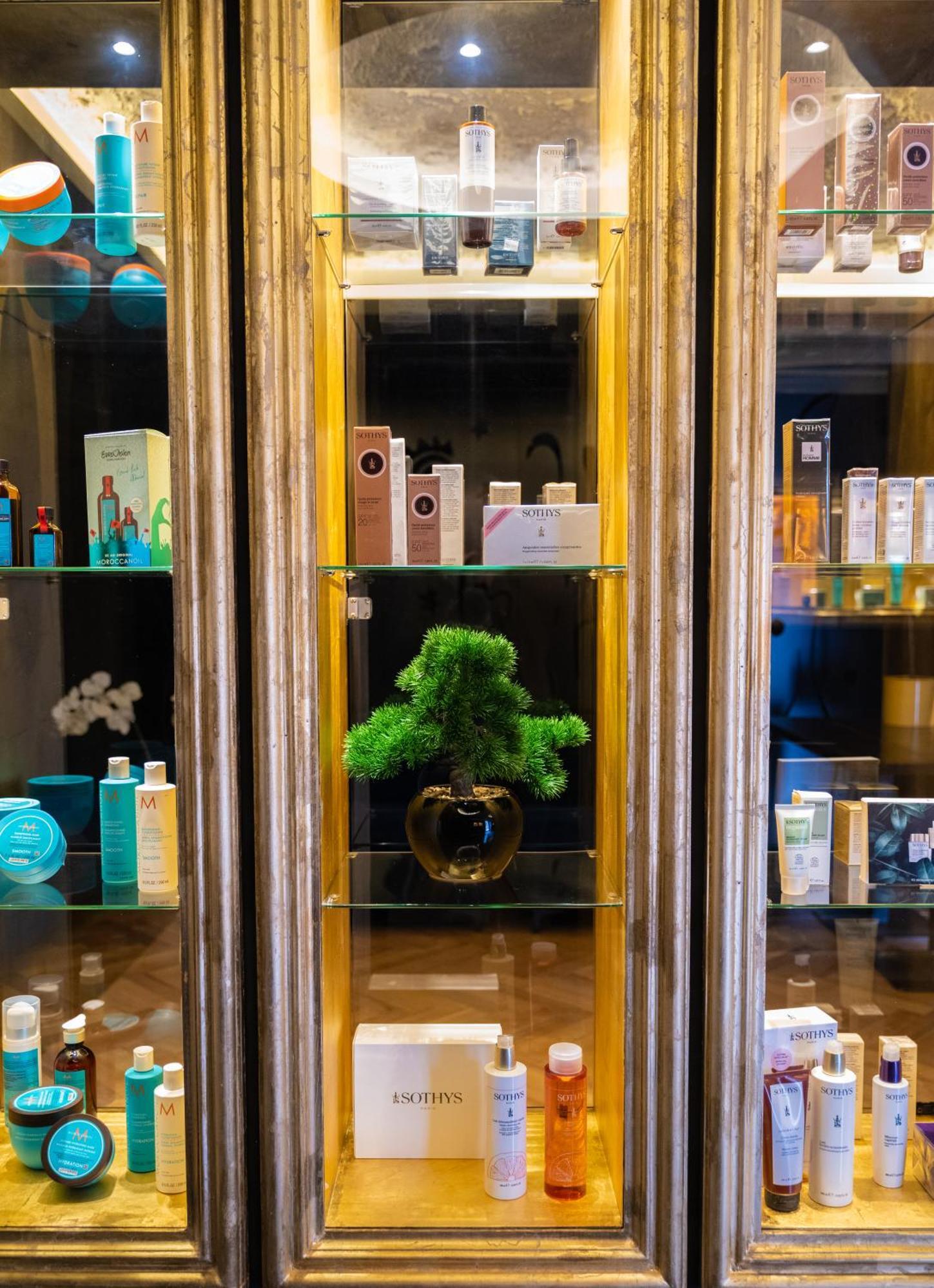 Arka Art Hotel Tirana Kültér fotó A display of various skincare products